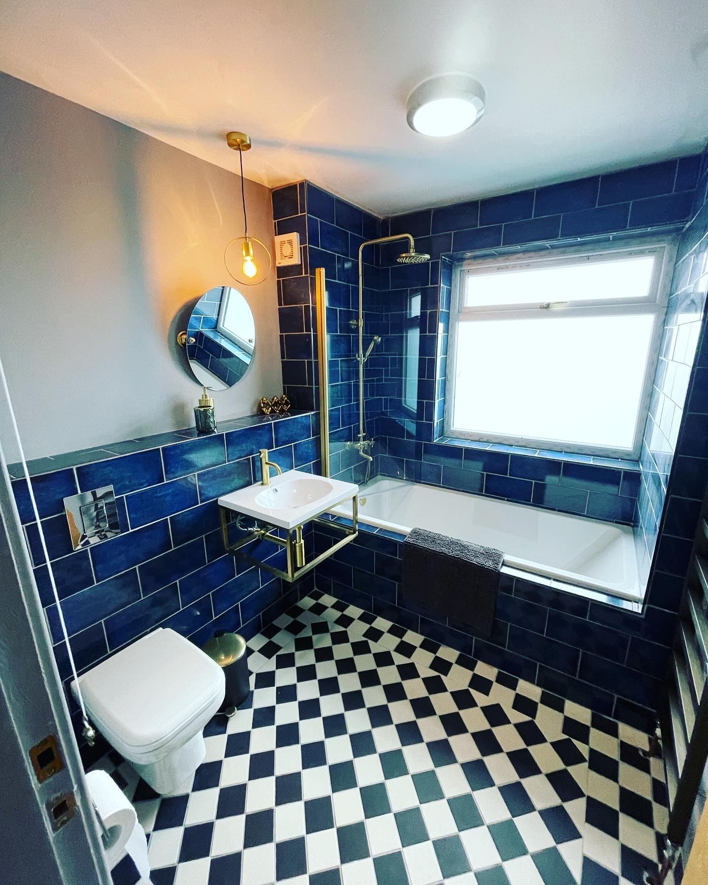 Completed blue bathroom by SJM Heating