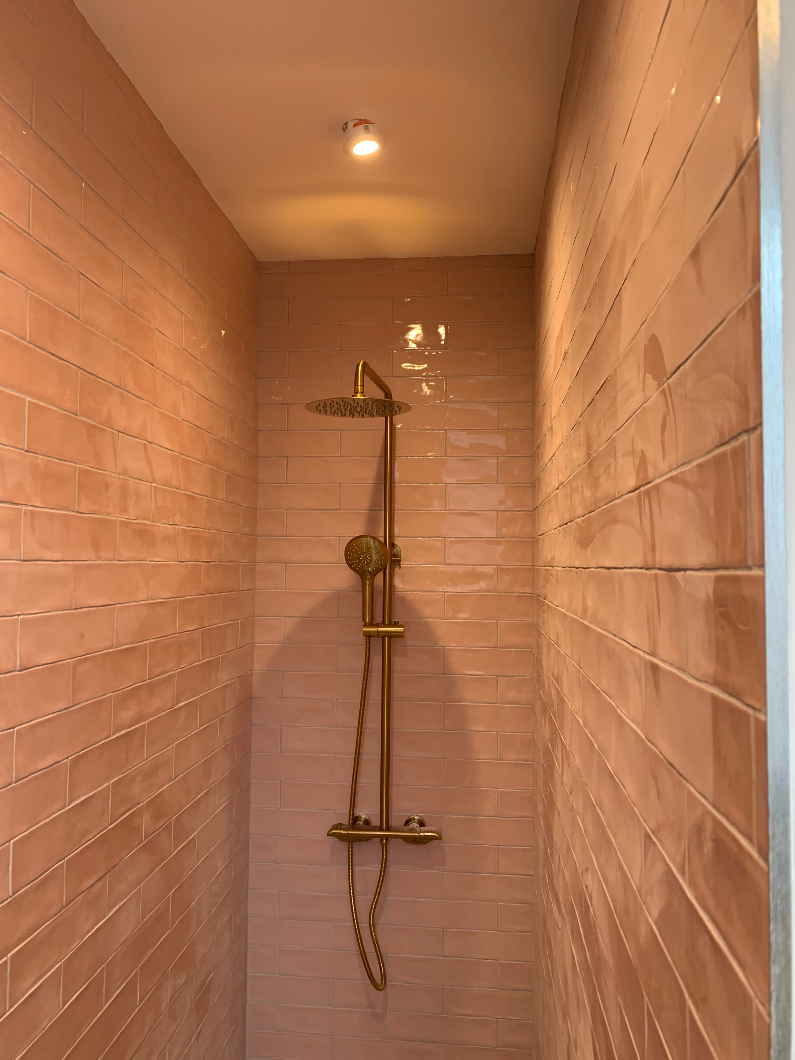 Tile and brassware detail in a finished bathroom