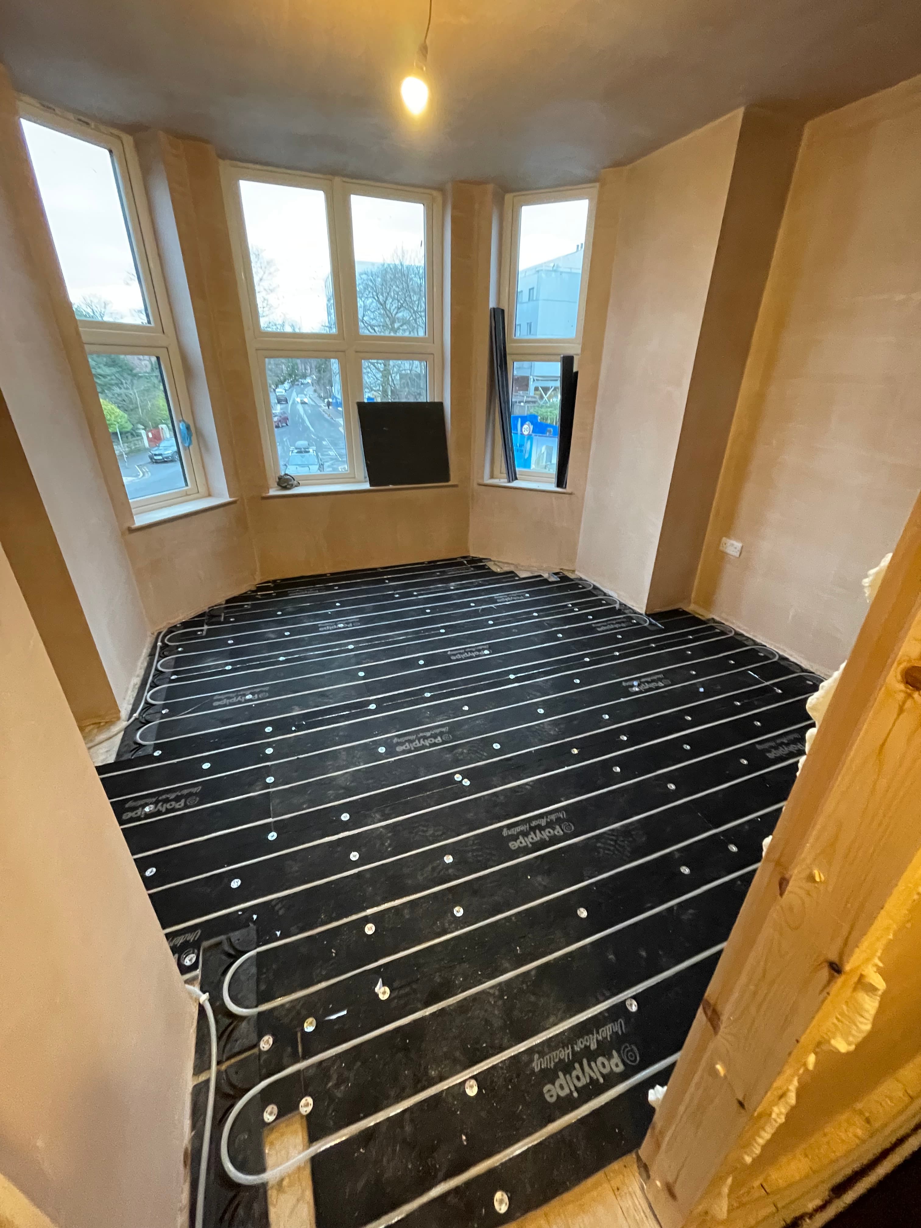 Underfloor heating in a bay window room